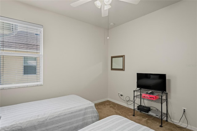 bedroom featuring ceiling fan and light carpet