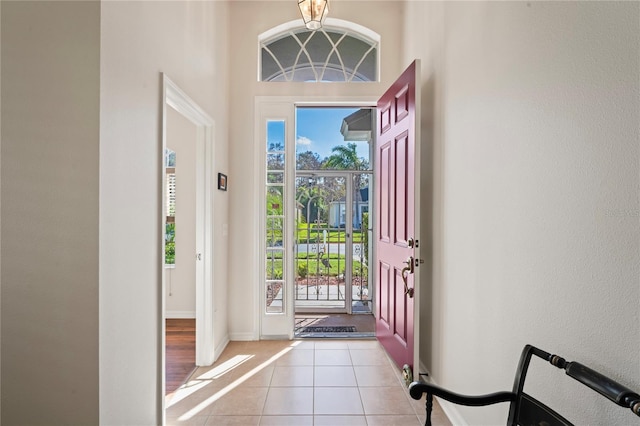 entryway with light tile patterned flooring