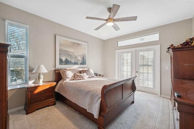 carpeted bedroom featuring ceiling fan, french doors, and access to exterior