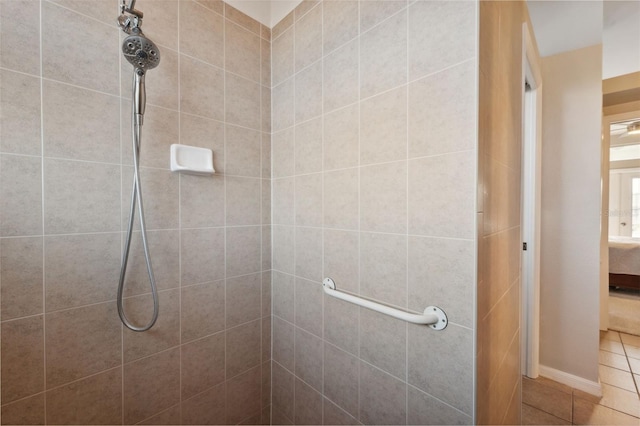 bathroom with tiled shower