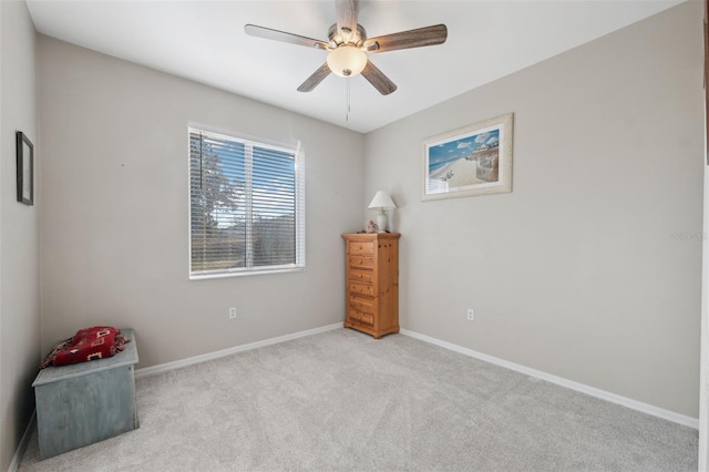 unfurnished bedroom featuring light colored carpet and ceiling fan