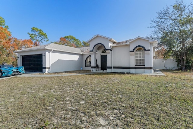 view of front facade featuring a front yard and a garage