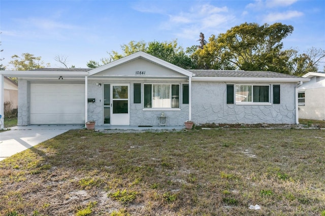 ranch-style house with a front lawn and a garage