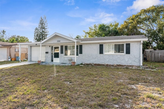 ranch-style home with a front lawn and a garage