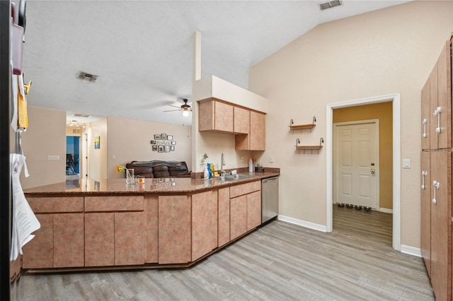 kitchen with sink, dishwasher, lofted ceiling, ceiling fan, and light hardwood / wood-style flooring