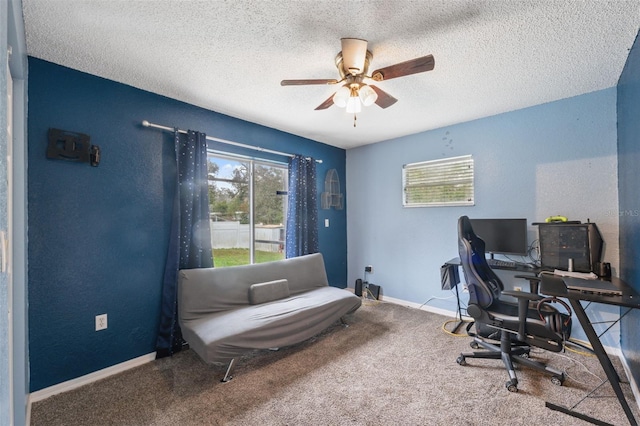 office with carpet flooring, a textured ceiling, and ceiling fan