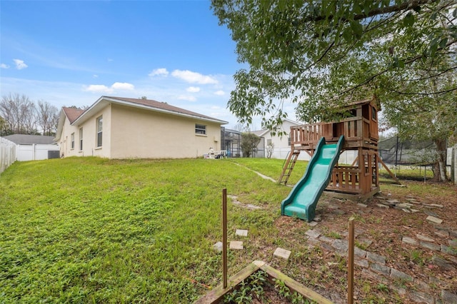 view of play area with a yard