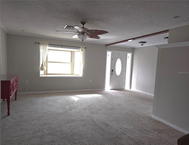 spare room with ceiling fan, a healthy amount of sunlight, and a textured ceiling