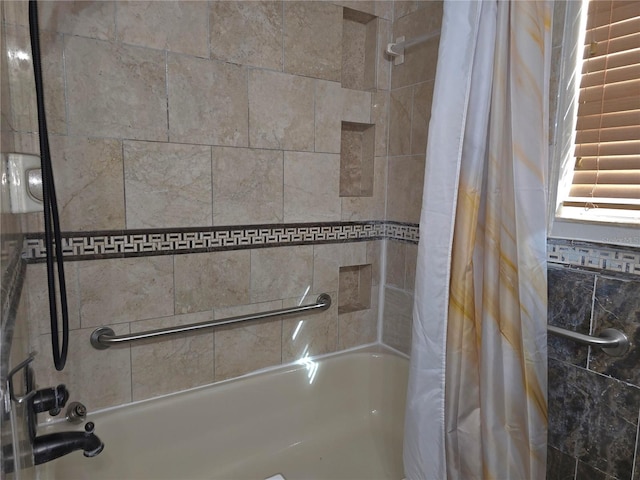 room details featuring shower / bath combo with shower curtain