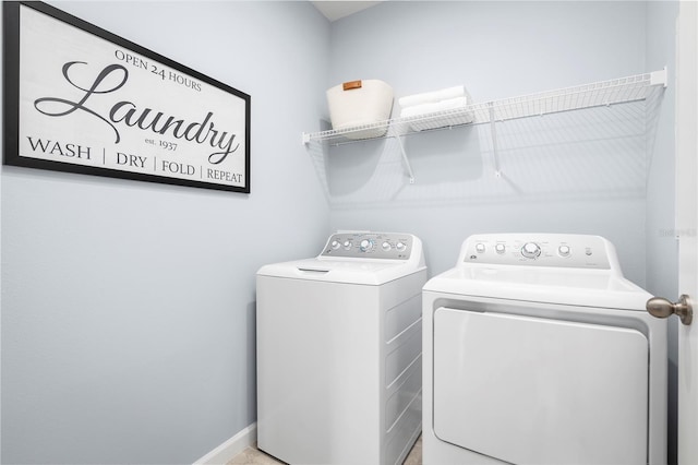 clothes washing area with washing machine and clothes dryer