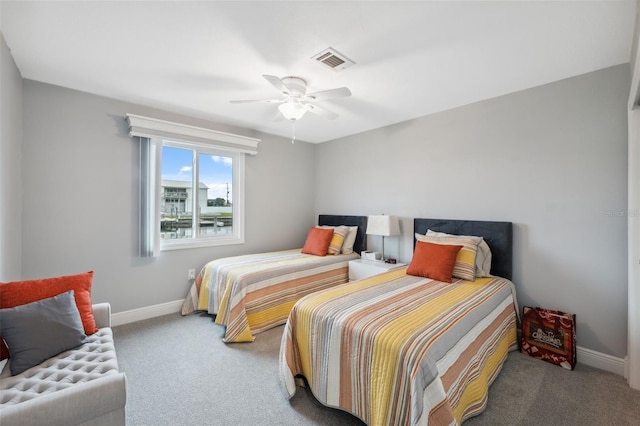 bedroom with ceiling fan and carpet