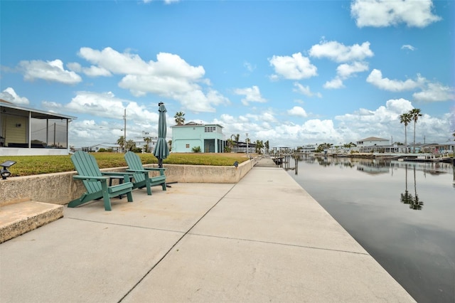 view of home's community with a boat dock and a water view