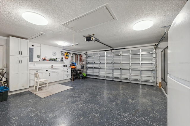 garage featuring electric panel and a garage door opener