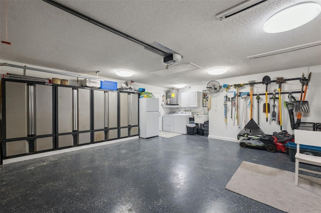 garage with white fridge, a garage door opener, and independent washer and dryer