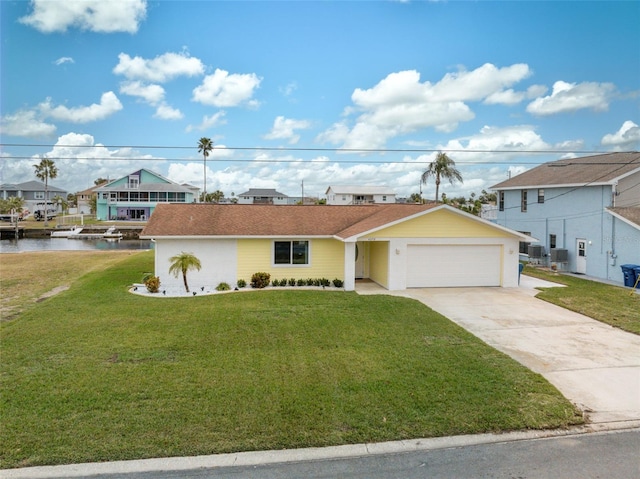 view of front facade with a front lawn and a water view