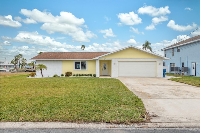 view of front of house featuring a front yard and a garage