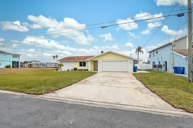 view of front of property with a front lawn and a garage