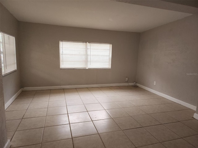 spare room with light tile patterned floors