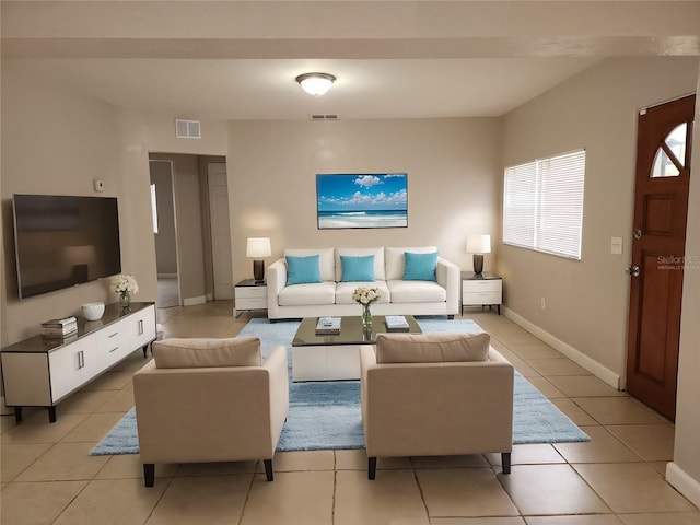 living room with light tile patterned floors