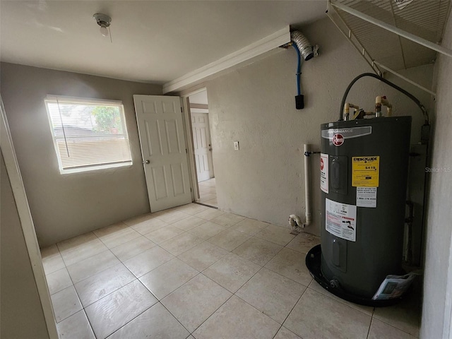 utility room featuring water heater