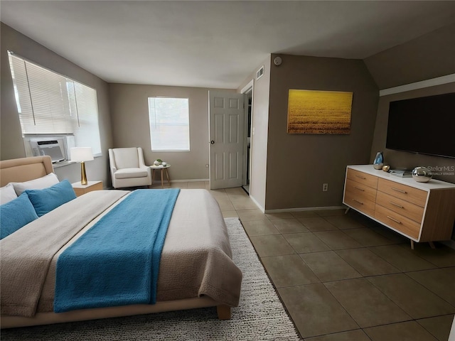 bedroom featuring lofted ceiling, dark tile patterned floors, and cooling unit