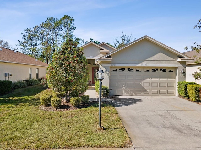 single story home featuring a garage and a front yard