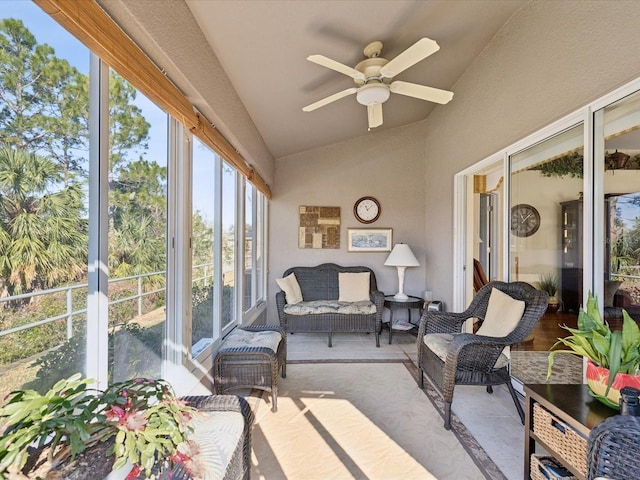 sunroom with lofted ceiling and ceiling fan