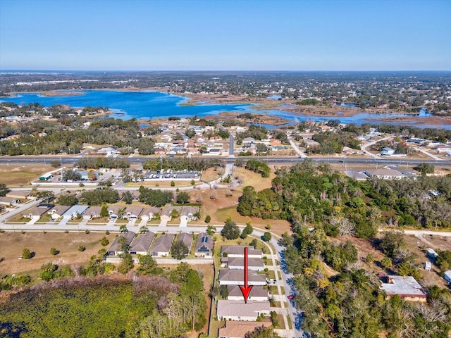 birds eye view of property featuring a water view