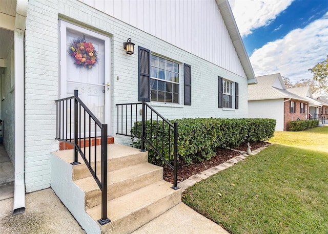 entrance to property with a yard