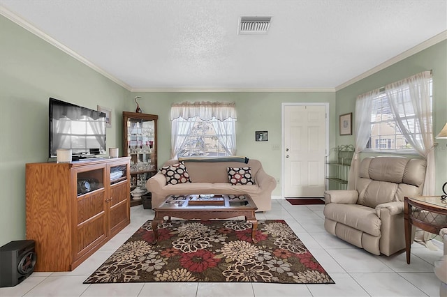 tiled living room with a textured ceiling and ornamental molding