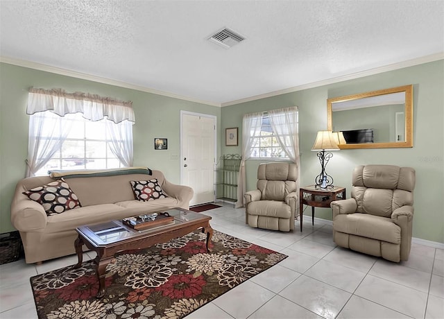 living room featuring ornamental molding, light tile patterned flooring, and a textured ceiling