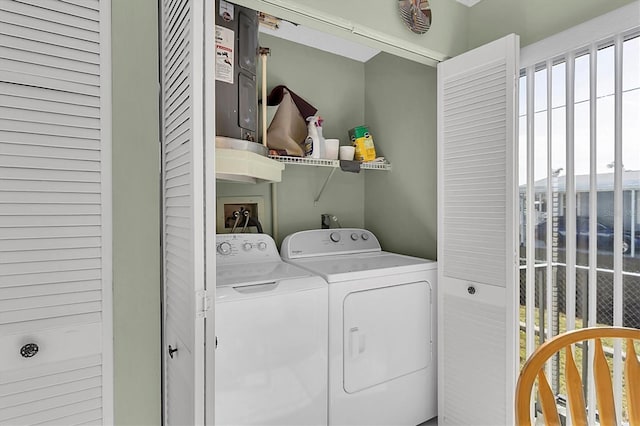 laundry room with washer and clothes dryer and a wealth of natural light