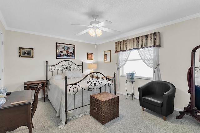 carpeted bedroom with ceiling fan, crown molding, and a textured ceiling