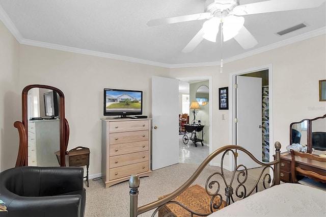 carpeted bedroom with a textured ceiling, ceiling fan, and ornamental molding