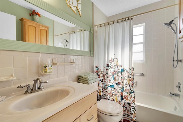 full bathroom with toilet, shower / bath combo with shower curtain, tile walls, backsplash, and vanity