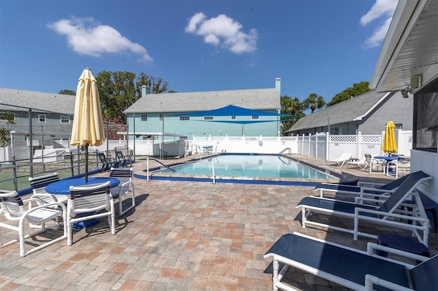 view of swimming pool with a patio