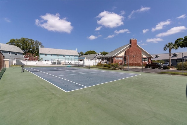 view of sport court featuring basketball hoop