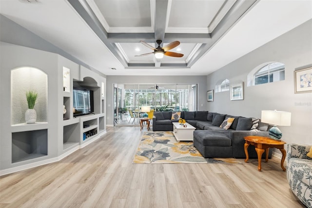 living room with coffered ceiling, light hardwood / wood-style floors, built in shelves, ceiling fan, and beamed ceiling