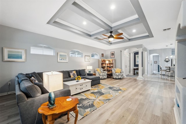 living room with coffered ceiling, light hardwood / wood-style floors, ceiling fan, beam ceiling, and decorative columns