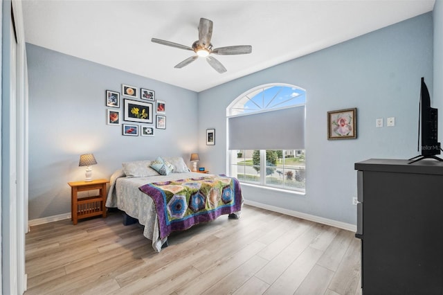 bedroom with ceiling fan and light hardwood / wood-style floors