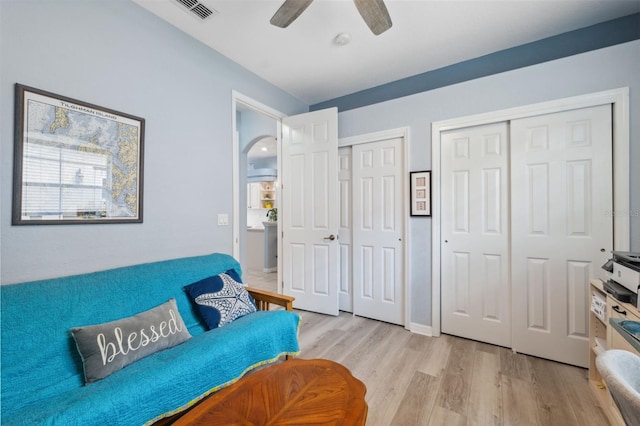 sitting room with ceiling fan and light hardwood / wood-style floors