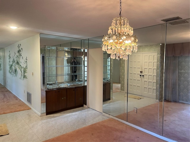 wine cellar featuring a notable chandelier and light carpet