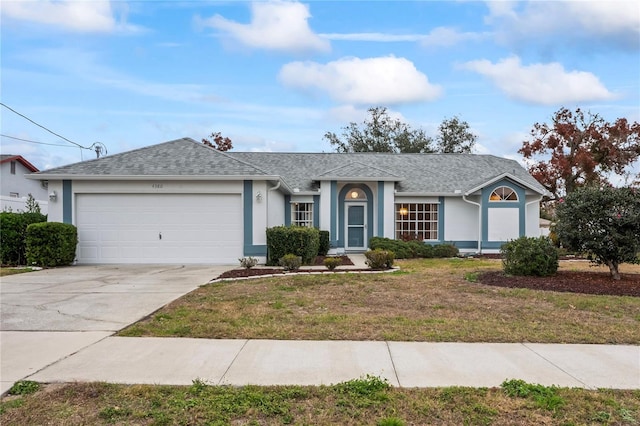 ranch-style home featuring a front lawn and a garage