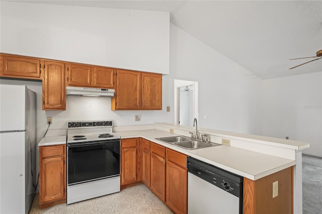 kitchen with white appliances, kitchen peninsula, high vaulted ceiling, ceiling fan, and sink