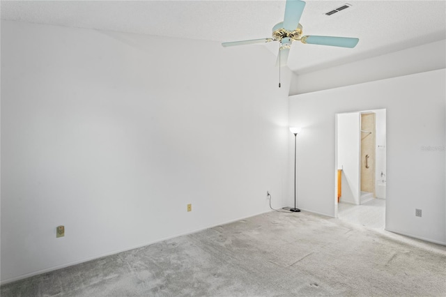 carpeted empty room featuring a high ceiling and ceiling fan