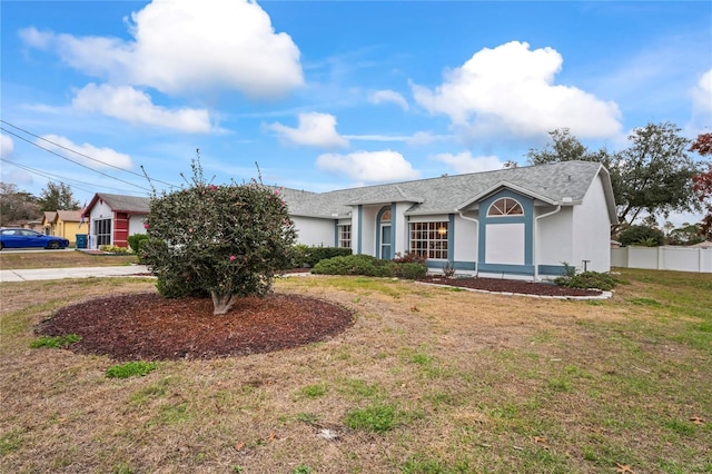 single story home featuring a front yard