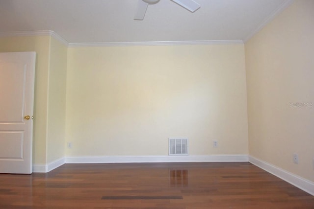 unfurnished room featuring ornamental molding, ceiling fan, and dark wood-type flooring