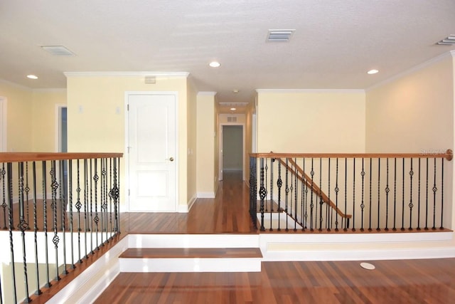 hall with crown molding and dark hardwood / wood-style floors