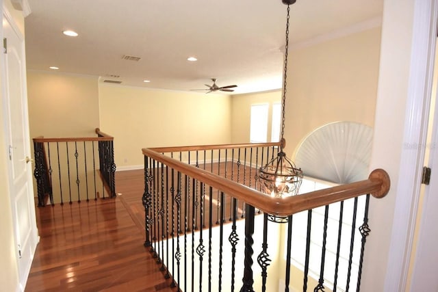 hallway featuring dark wood-type flooring and crown molding