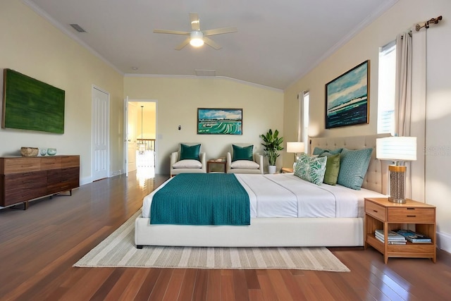 bedroom featuring vaulted ceiling, a closet, wood-type flooring, crown molding, and ceiling fan